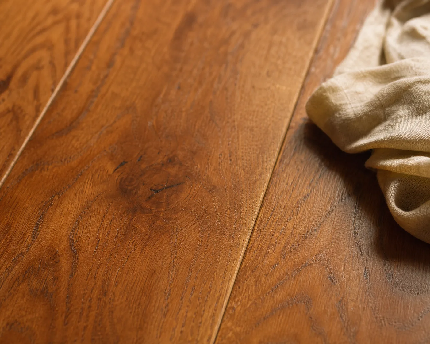 Finished cured oiled oak interior floor with a soft silky-matte open-pore sheen and a buffing cloth