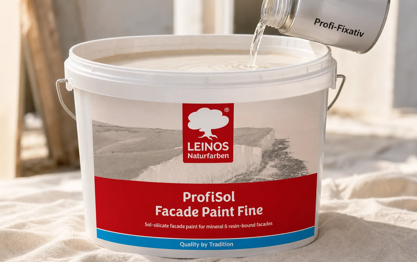 Pouring clear Profi-Fixativ from a canister into the branded LEINOS ProfiSol Facade Paint Fine bucket to thin the mineral paint