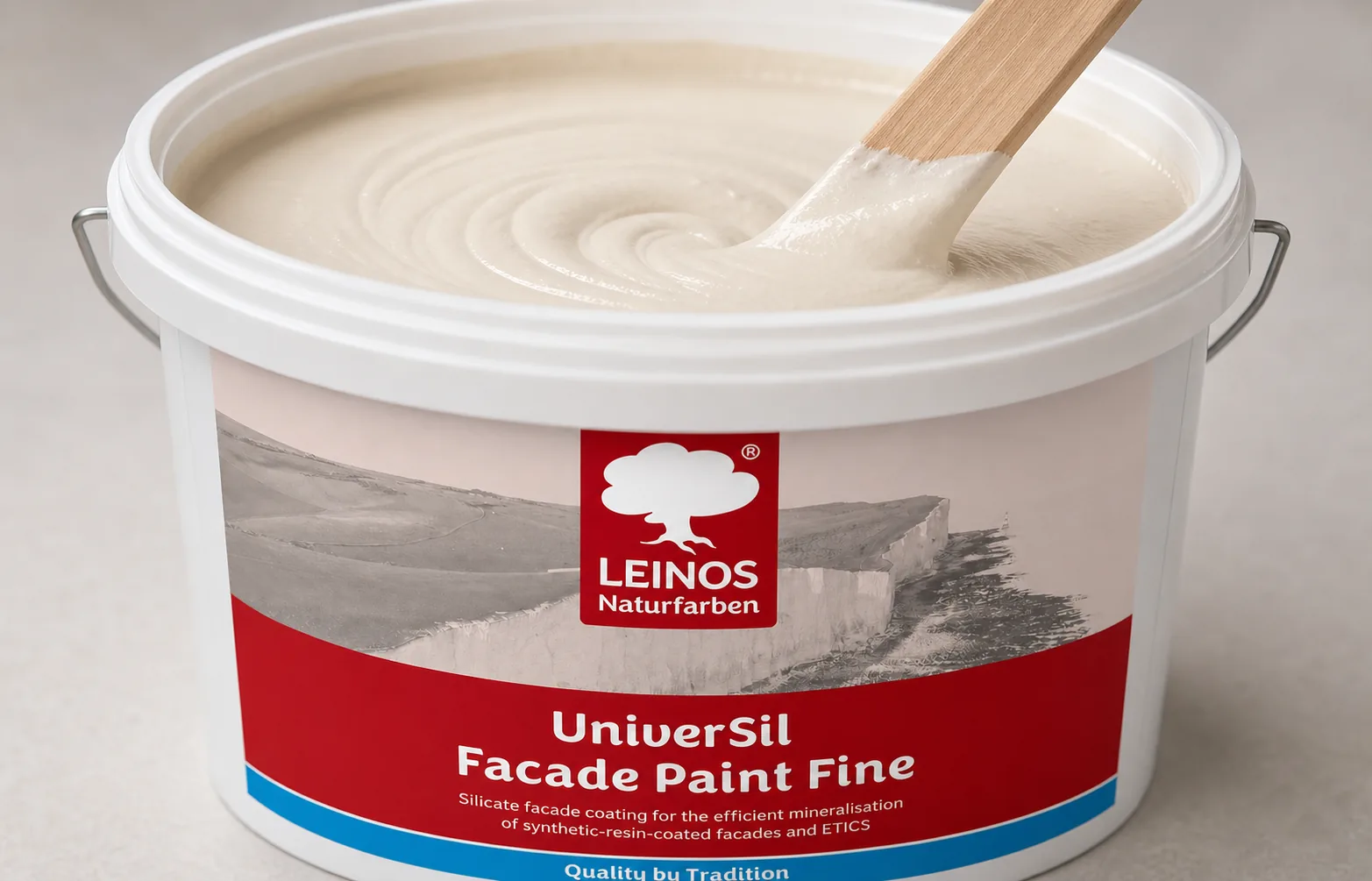Open branded white LEINOS UniverSil Facade Paint Fine bucket with a paddle stirring pale mineral facade paint