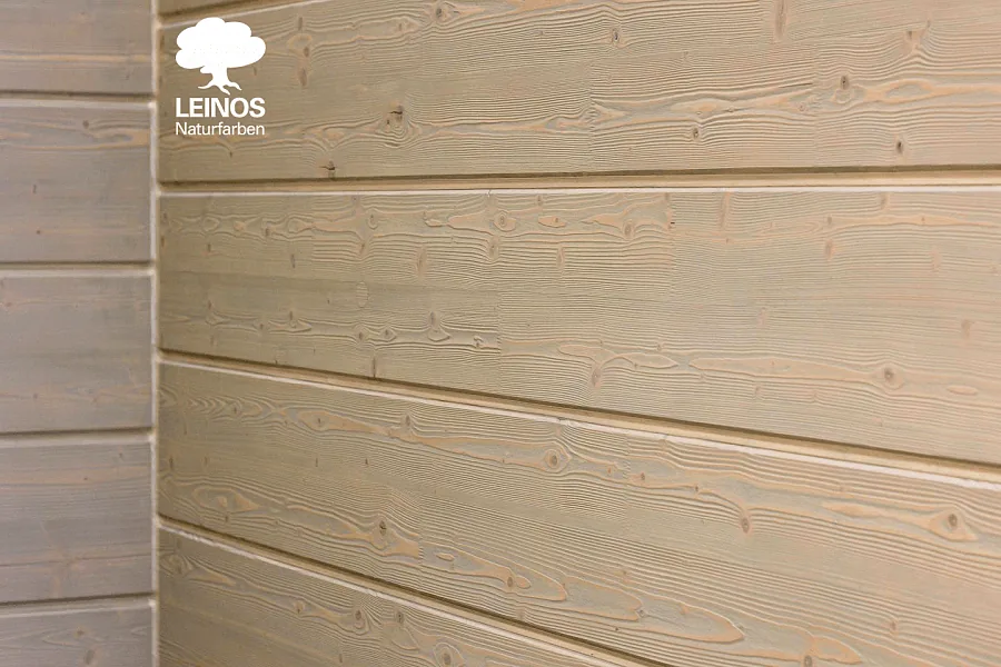 Raking-light view of the paneling — texture reads strongly across the wall under angled light.