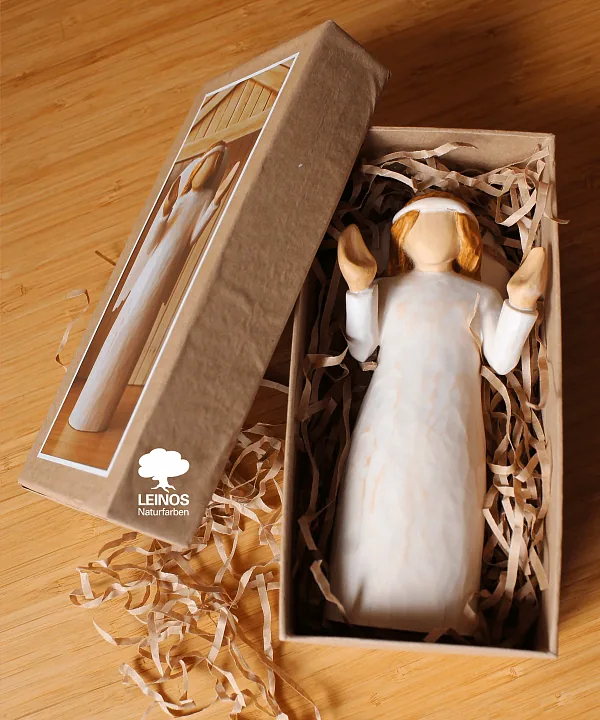 Angel figure showing winged detail without oil pooling in the carved feather lines.