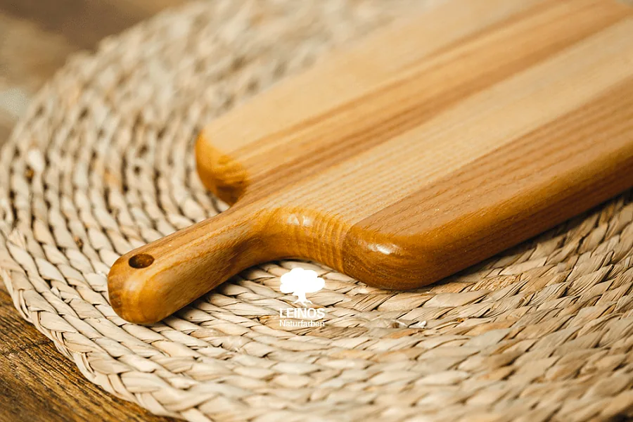 Board face with visible wood grain reading through the smooth satin oil finish.