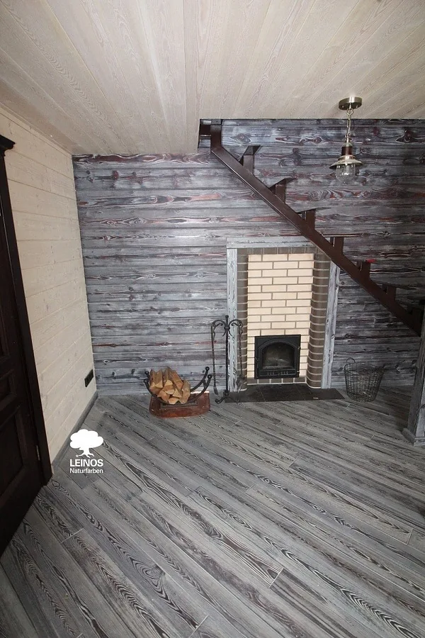 Grey-Stained Wood Floors and Walls with Fireplace