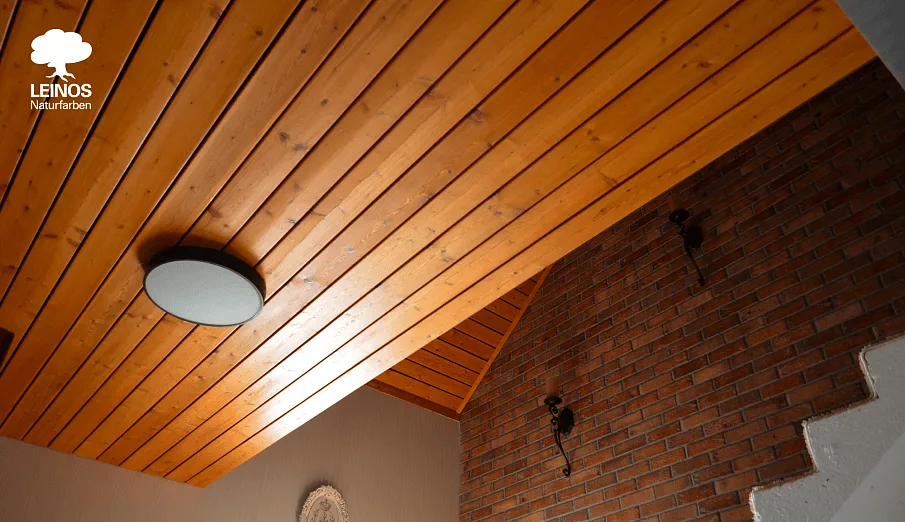 Detail of larch grain reading clearly under the clear-oil finish.