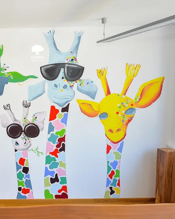 Mural detail at child eye-level — brush strokes legible without surface gloss flattening the artwork.
