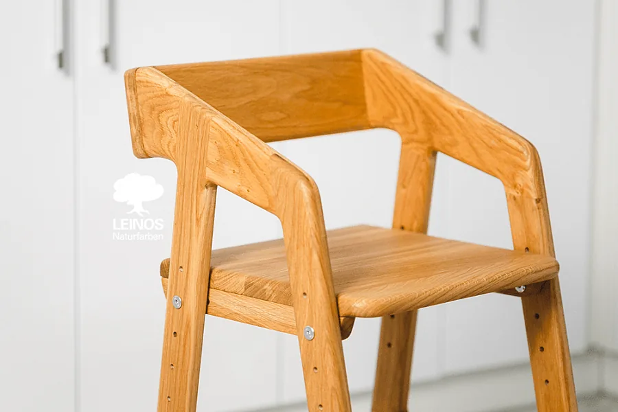 Side view of the chair frame — every component including joinery surfaces oiled pre-assembly.