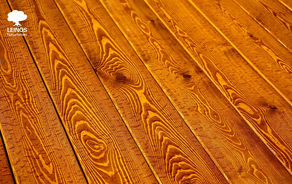 Sloped Japanese-inspired roof overhang detail — exposed timber beams under LEINOS Wood Varnish 260 with Pigment 668 for tone match.