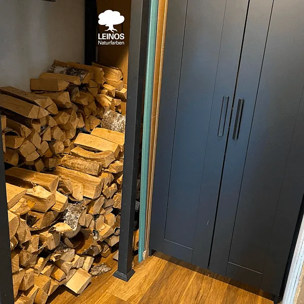 Wide view of the staircase + matching oak floor at the landing — single warm-brown register across the tread and floor planes.