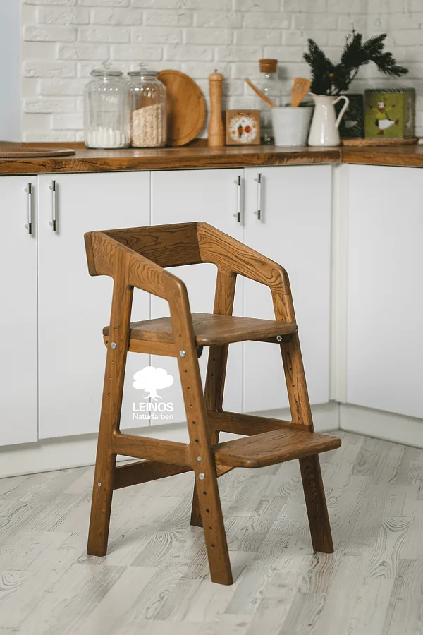 Side view of the assembled chair — uniform dark brown tone across every visible component.