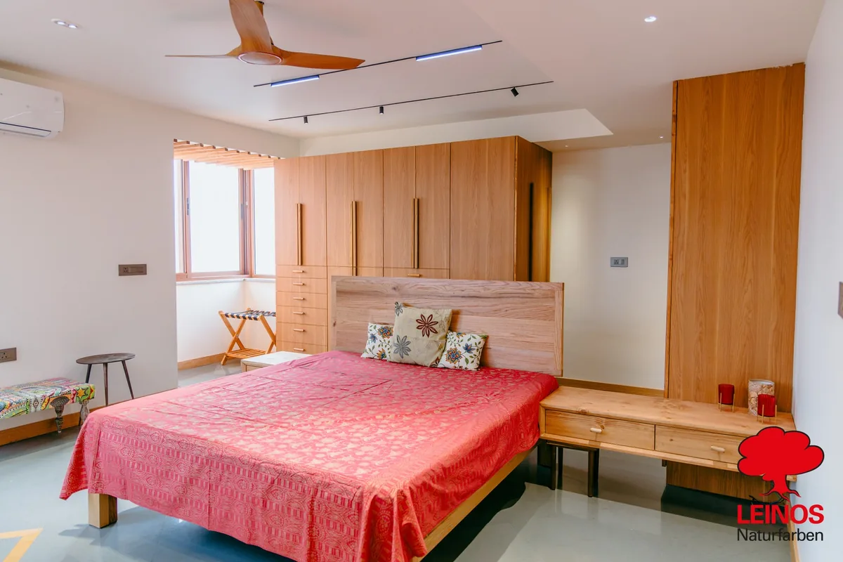 Vertical pine wall panelling joint detail — uniform warm golden tone across plank-to-plank junctions.