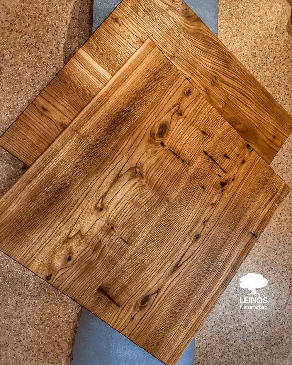 Close-up of a cut-out handle — end-grain saturation matched to the board face after extra oil passes at the high-absorption rim.