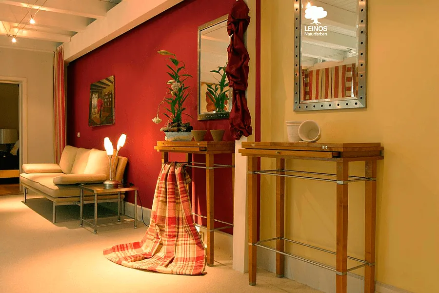 Deep Red Accent Wall with Warm Decor