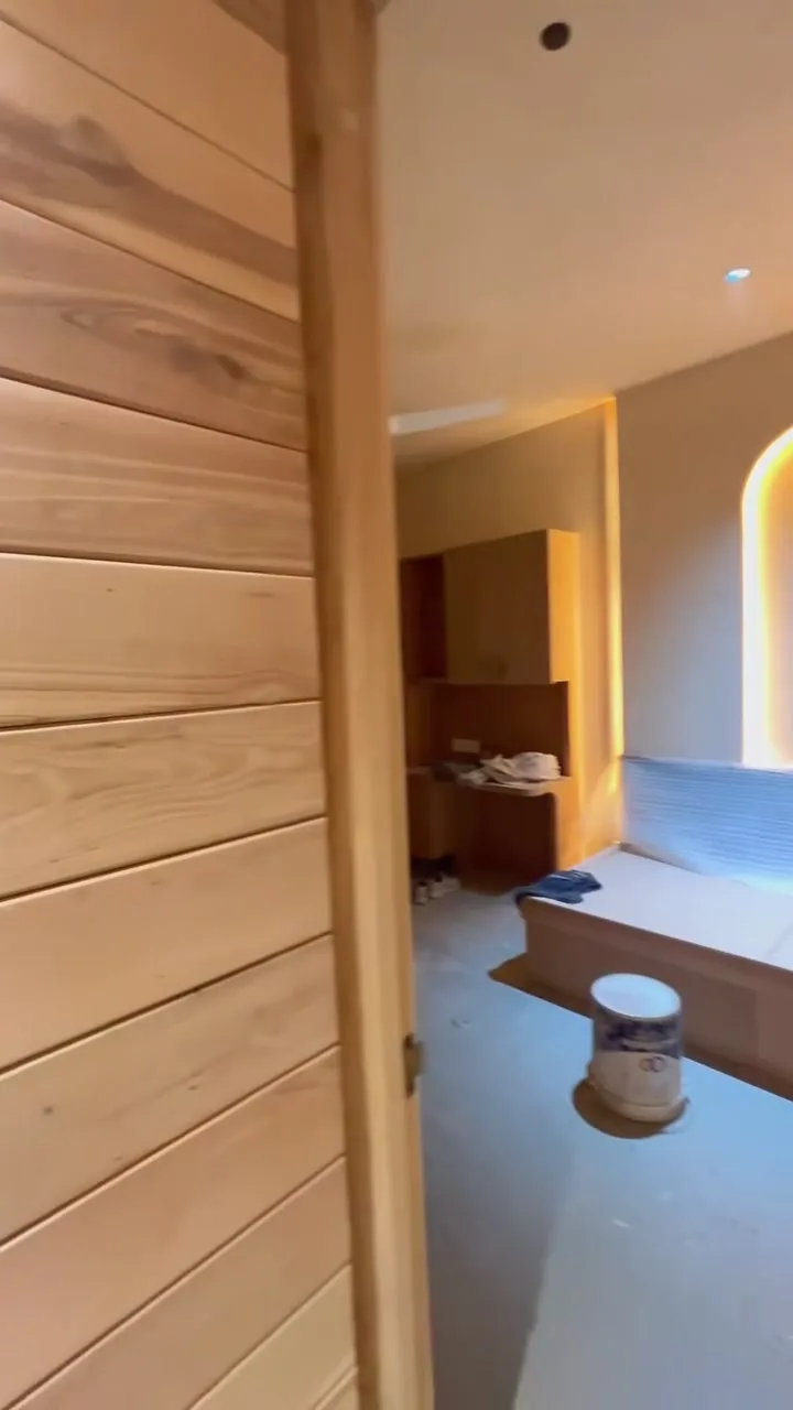 A walkthrough Reel of a whole-home LEINOS project in Noida — Lime Paint 665 across the walls and exposed brick, and colourless Hardwax Oil 290 on the barn doors, wall panelling, arched dresser and ceiling beams. A brand walkthrough carrying LEINOS's product claims, filmed on site with protective sheeting still in place.