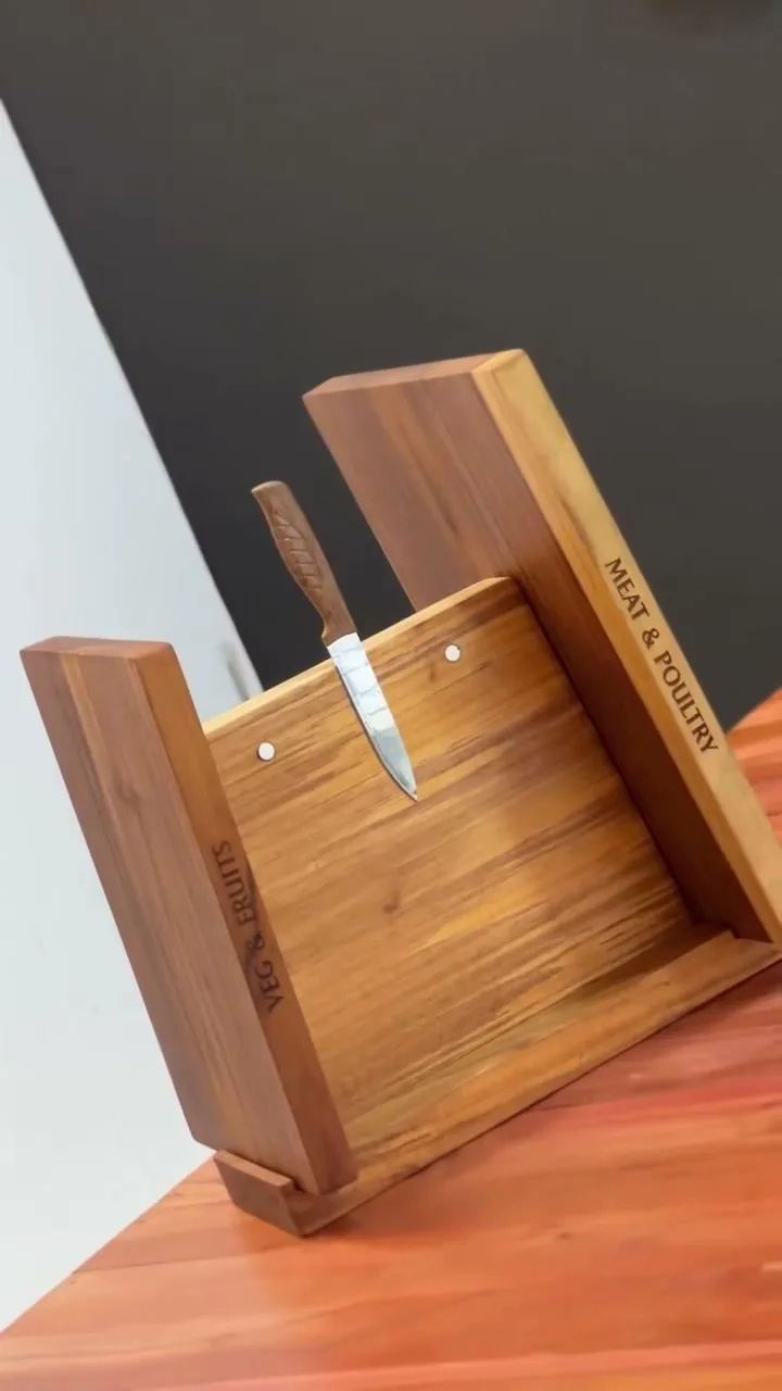 A UGC Reel by @teakin_decor: a solid teak kitchen board set — a knife-block stand with VEG & FRUITS and MEAT & POULTRY chopping boards — sanded and finished with food-safe LEINOS Countertop Oil 280. A maker's build-and-finish video; LEINOS was tagged, not the author.