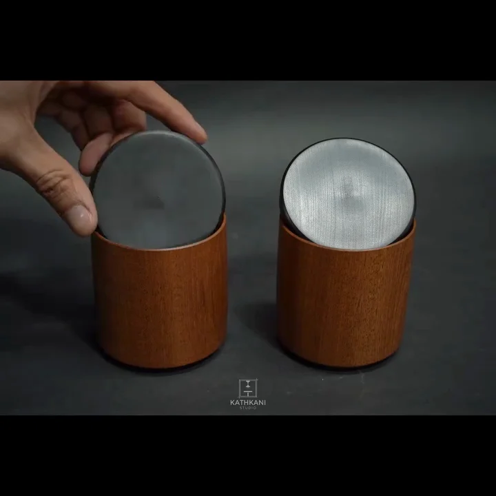 The two sapele boxes with their ebonised lids lifted off, showing the hollowed endgrain interiors — one lid finished matte, the other satin, in LEINOS Interior Hardwax Oil 290.
