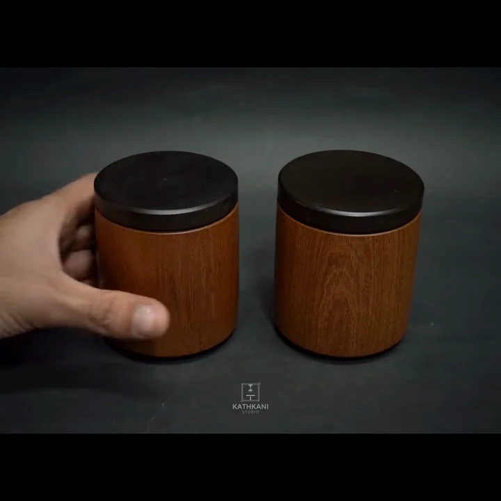 A turned sapele box held in hand for scale, its ebonised lid and LEINOS Interior Hardwax Oil 290 finish catching the light.