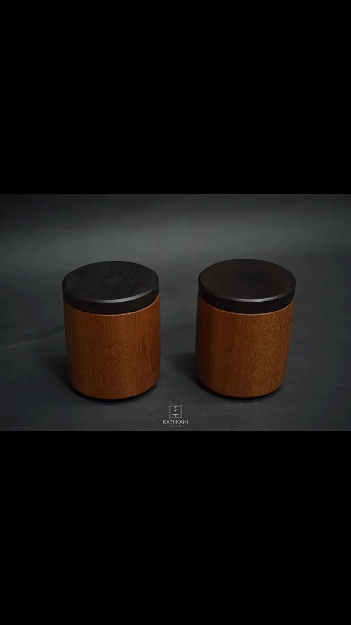 A maker's video by @kathkanistudio comparing two turned sapele boxes with ebonised endgrain lids — one finished in matte, the other in satin LEINOS Interior Hardwax Oil 290 — turning the lids to the light to show the difference in sheen. LEINOS was tagged, not the author.